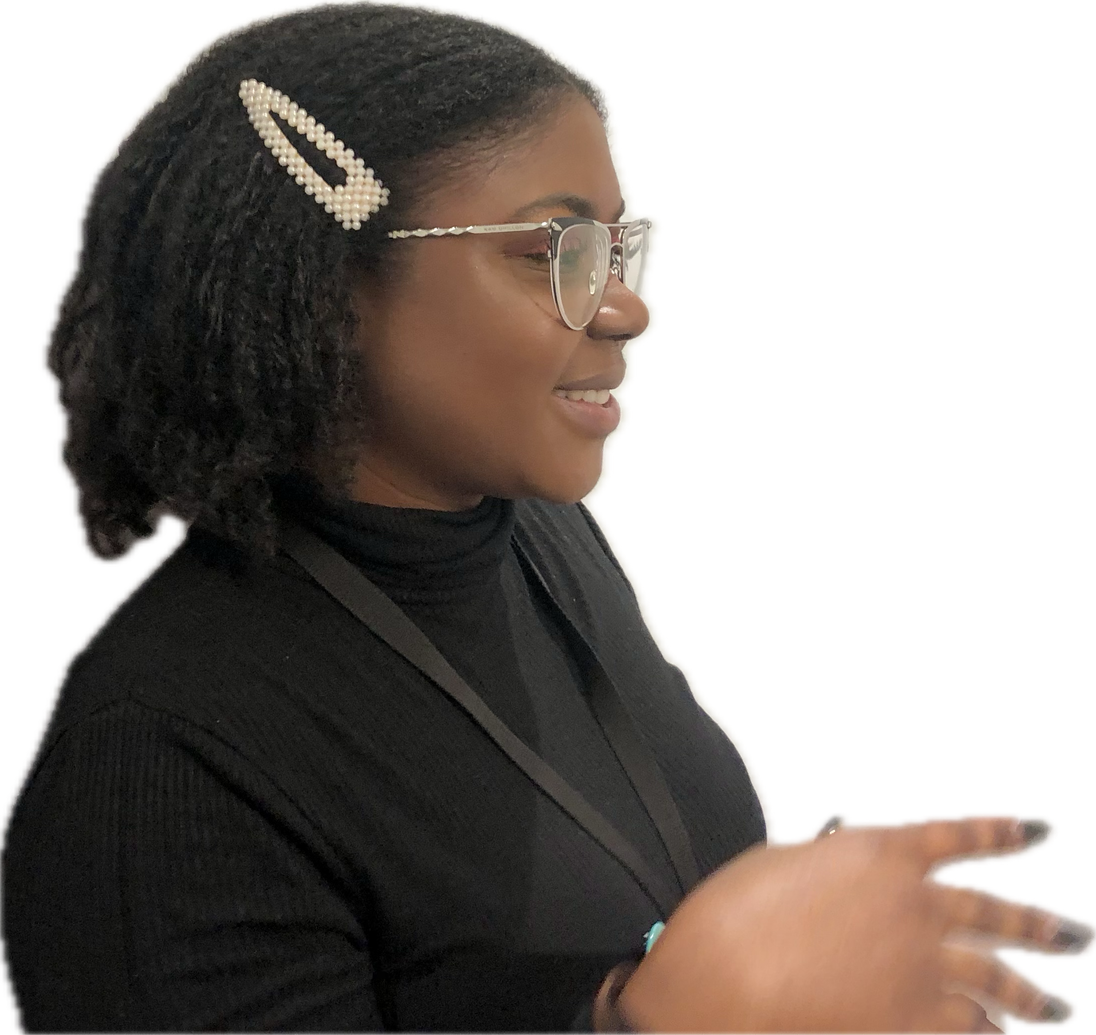 Feyi Agbaje speaking in profile while wearing glasses